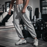Men's Solid Cotton Holes Loose Sports Fitness Casual Trousers 09609887Z